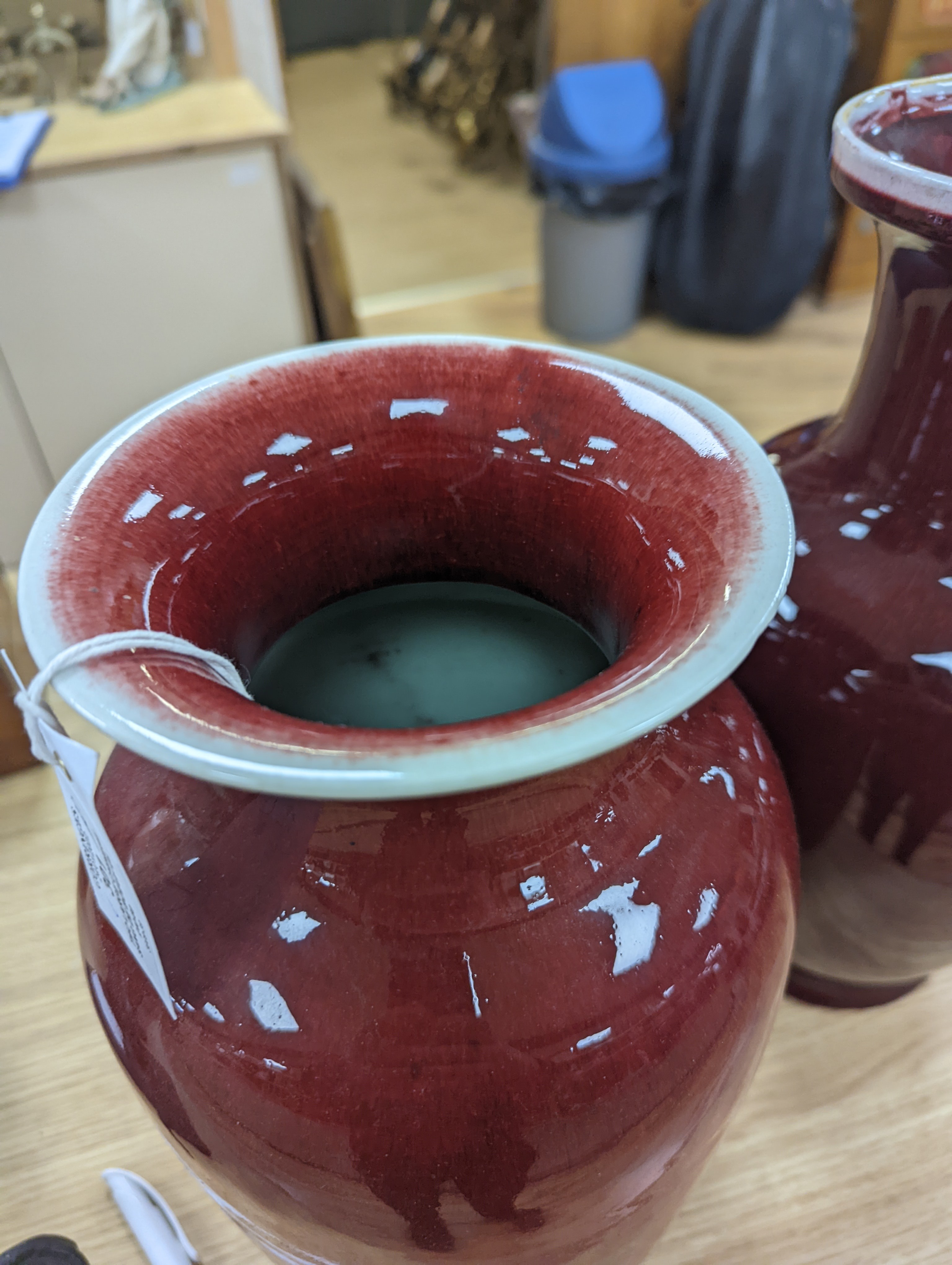 Two large Chinese sang de boeuf glazed vases tallest 36cm